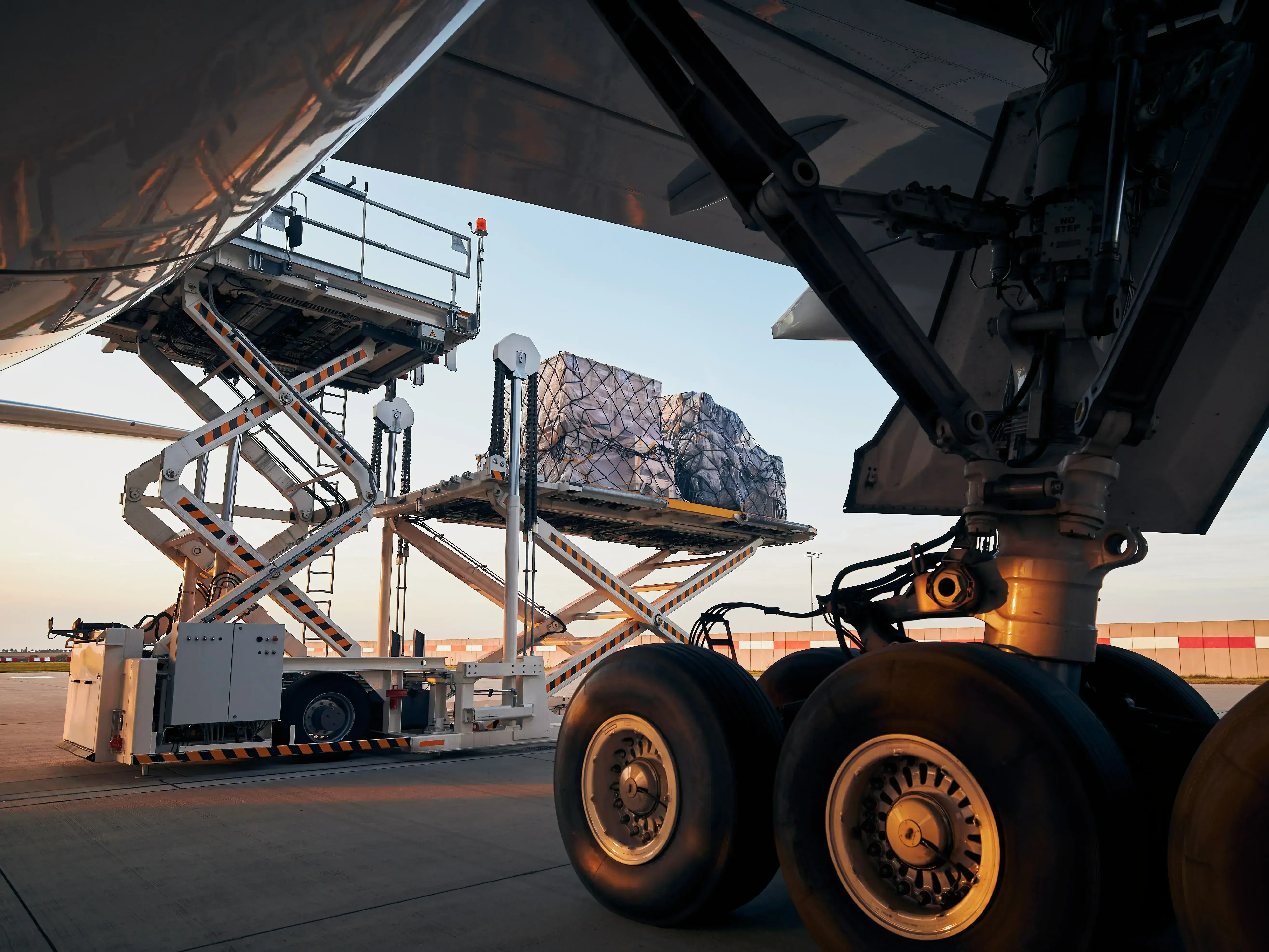 Cargo being loaded into an aircraft with a lift
